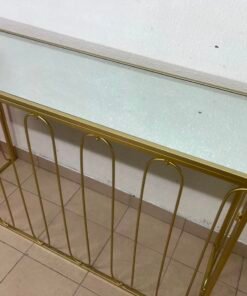 Modern console table with a gold metal frame and reflective glass top - Image 6