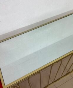 Modern console table with a gold metal frame and reflective glass top - Image 10