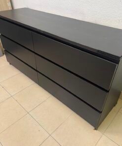 The MALM chest of drawers from IKEA, in black and brown, features a simple and modern design. - Image 12