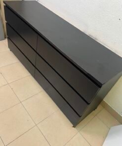 The MALM chest of drawers from IKEA, in black and brown, features a simple and modern design. - Image 2
