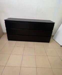 The MALM chest of drawers from IKEA, in black and brown, features a simple and modern design. - Image 3
