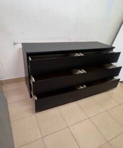 The MALM chest of drawers from IKEA, in black and brown, features a simple and modern design. - Image 11