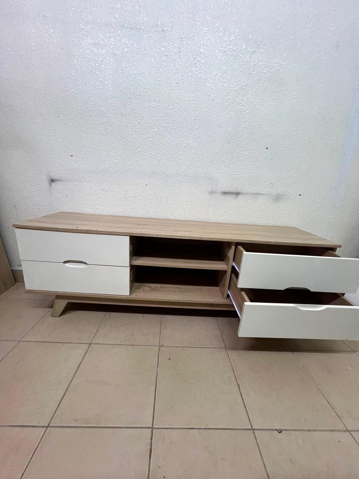 The Lucid TV unit from Home Centre features a simple geometric wood design with white drawers. - Image 8