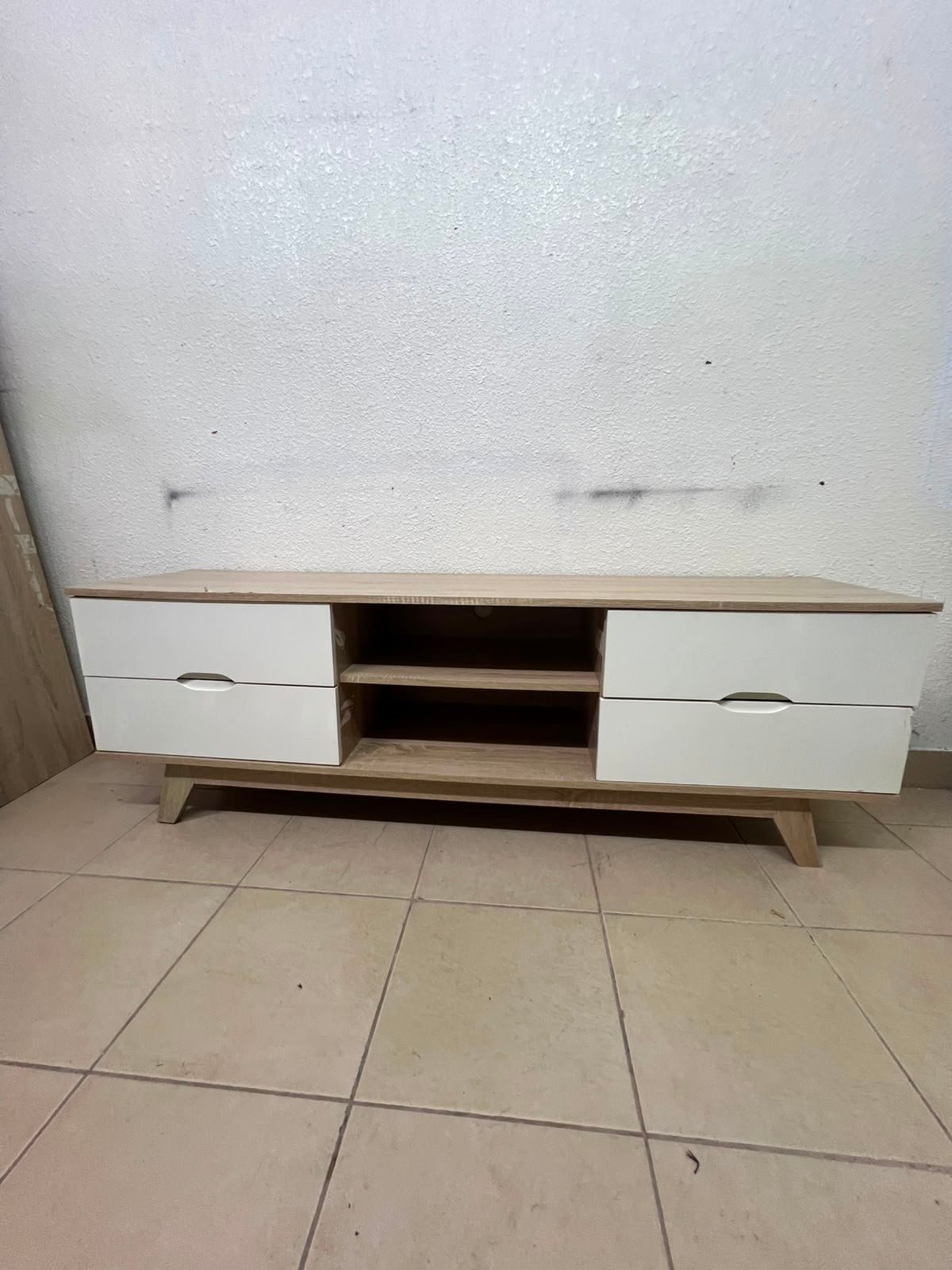 The Lucid TV unit from Home Centre features a simple geometric wood design with white drawers. - Image 5