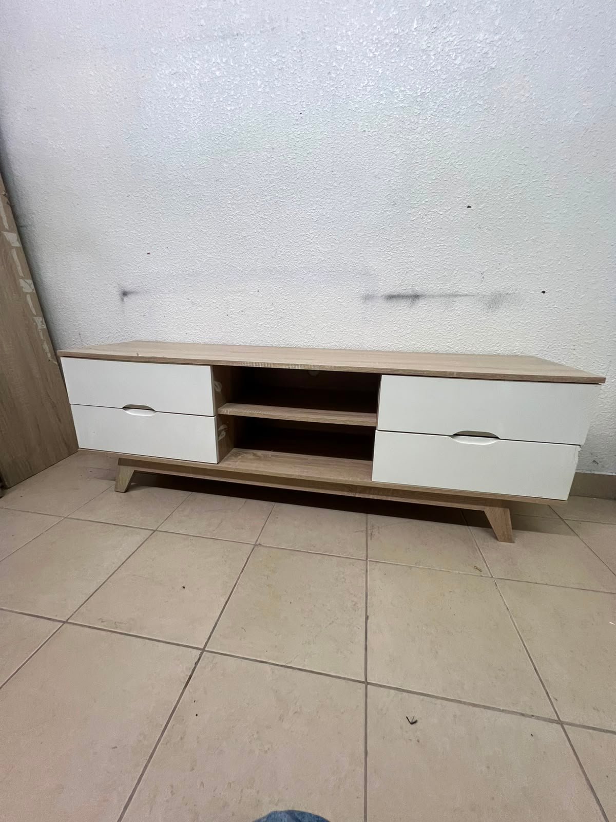 The Lucid TV unit from Home Centre features a simple geometric wood design with white drawers. - Image 4