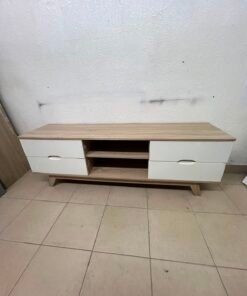 The Lucid TV unit from Home Centre features a simple geometric wood design with white drawers.