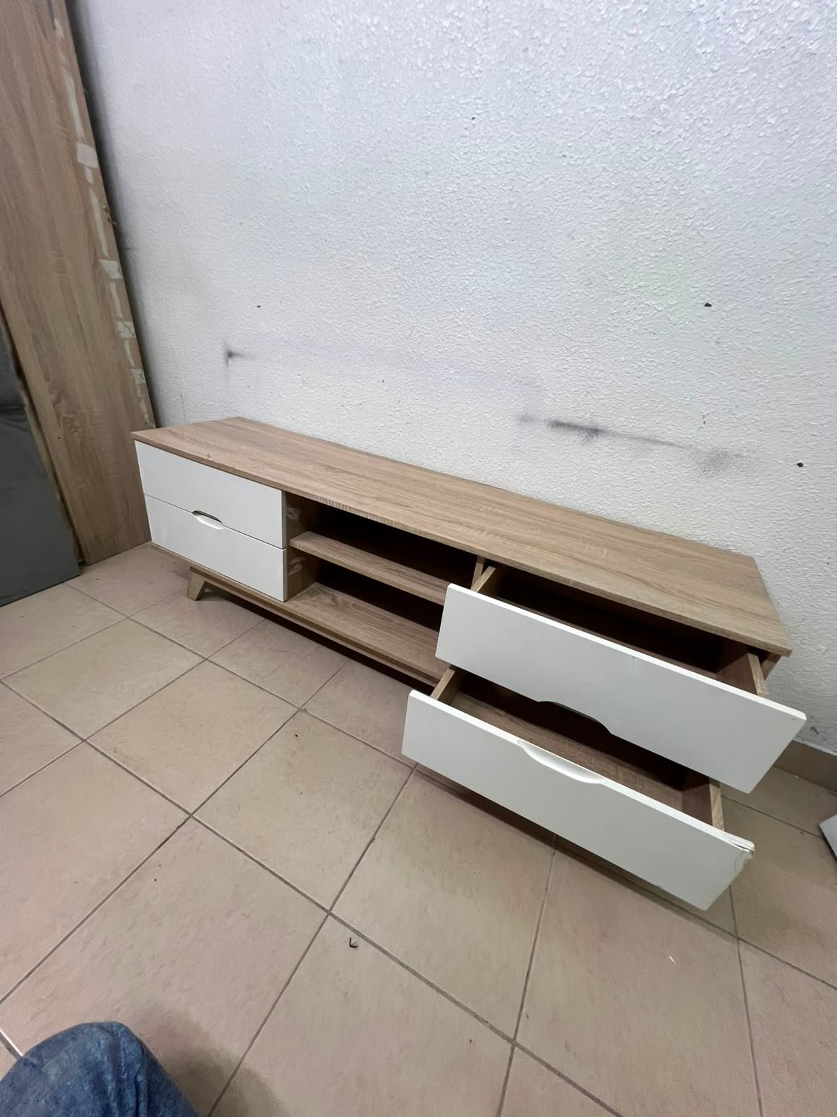 The Lucid TV unit from Home Centre features a simple geometric wood design with white drawers. - Image 2