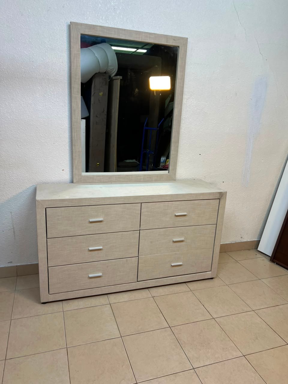 This piece resembles a Tisley or Vault-style mirrored wardrobe, featuring a light wood finish and modern silver handles.