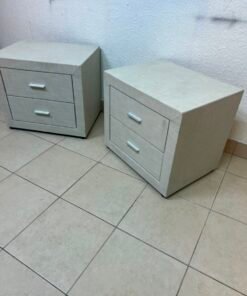 A beige upholstered nightstand with two drawers and silver handles. - Image 3