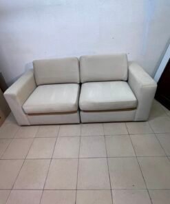 The KIVIK two-seater sofa is beige and features wide, low armrests. - Image 7