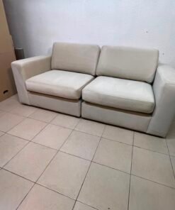 The KIVIK two-seater sofa is beige and features wide, low armrests. - Image 6
