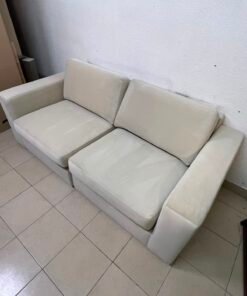 The KIVIK two-seater sofa is beige and features wide, low armrests. - Image 4