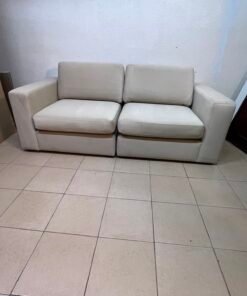 The KIVIK two-seater sofa is beige and features wide, low armrests. - Image 8