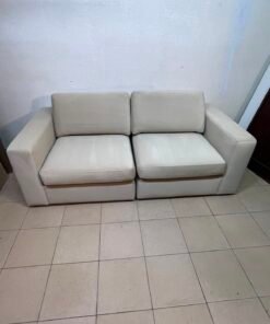 The KIVIK two-seater sofa is beige and features wide, low armrests. - Image 2