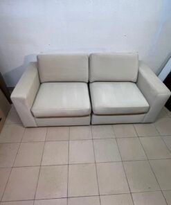 The KIVIK two-seater sofa is beige and features wide, low armrests. - Image 5