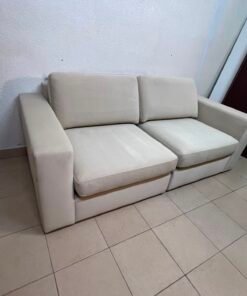 The KIVIK two-seater sofa is beige and features wide, low armrests. - Image 11