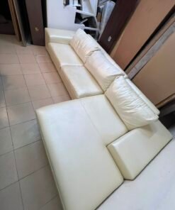 A modern L-shaped white leather sofa featuring a wide armrest and comfortable back cushions. - Image 3
