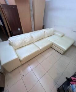A modern L-shaped white leather sofa featuring a wide armrest and comfortable back cushions. - Image 5