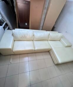 A modern L-shaped white leather sofa featuring a wide armrest and comfortable back cushions. - Image 7