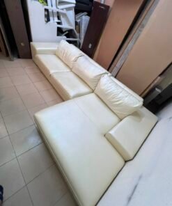 A modern L-shaped white leather sofa featuring a wide armrest and comfortable back cushions. - Image 13
