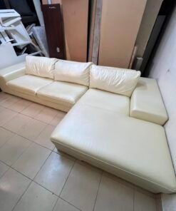 A modern L-shaped white leather sofa featuring a wide armrest and comfortable back cushions. - Image 12