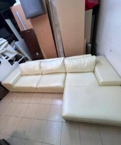A modern L-shaped white leather sofa featuring a wide armrest and comfortable back cushions. - Image 6