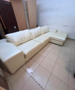 A modern L-shaped white leather sofa featuring a wide armrest and comfortable back cushions. - Image 8