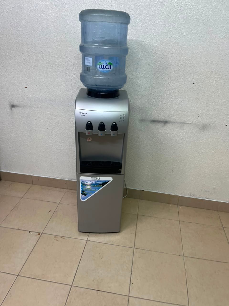 Hitachi Top-Loading Water Dispenser – Silver Freestanding Cooler with Hot, Cold & Room Temperature Taps, Compressor Cooling & Bottom Storage Cabinet