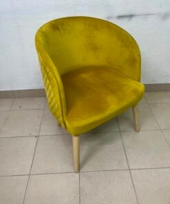 The modern chair features luxurious yellow velvet upholstery, a curved back with a padded design on the sides, and sturdy wooden legs. - Image 3