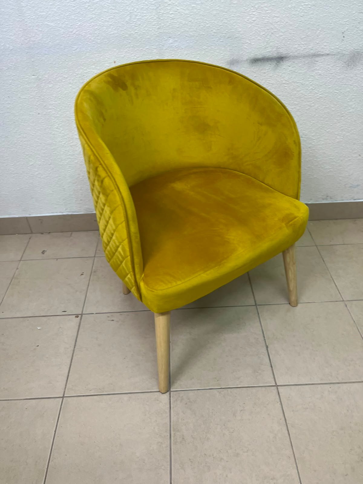 The modern chair features luxurious yellow velvet upholstery, a curved back with a padded design on the sides, and sturdy wooden legs. - Image 3