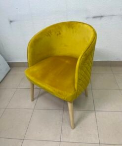 The modern chair features luxurious yellow velvet upholstery, a curved back with a padded design on the sides, and sturdy wooden legs. - Image 5