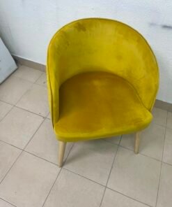 The modern chair features luxurious yellow velvet upholstery, a curved back with a padded design on the sides, and sturdy wooden legs. - Image 4