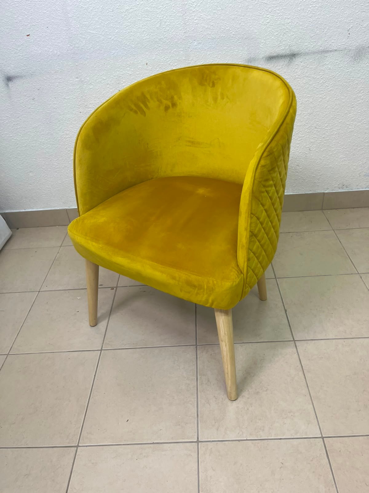 The modern chair features luxurious yellow velvet upholstery, a curved back with a padded design on the sides, and sturdy wooden legs. - Image 8