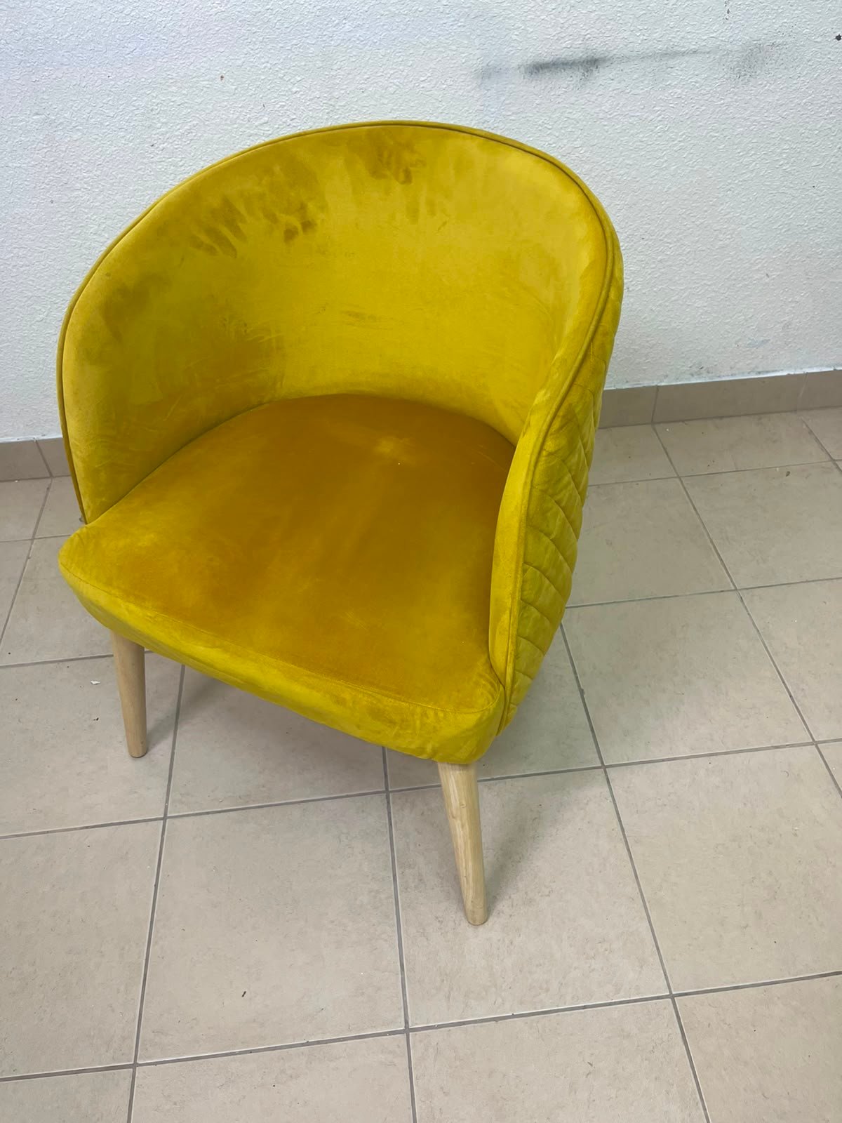 The modern chair features luxurious yellow velvet upholstery, a curved back with a padded design on the sides, and sturdy wooden legs. - Image 7