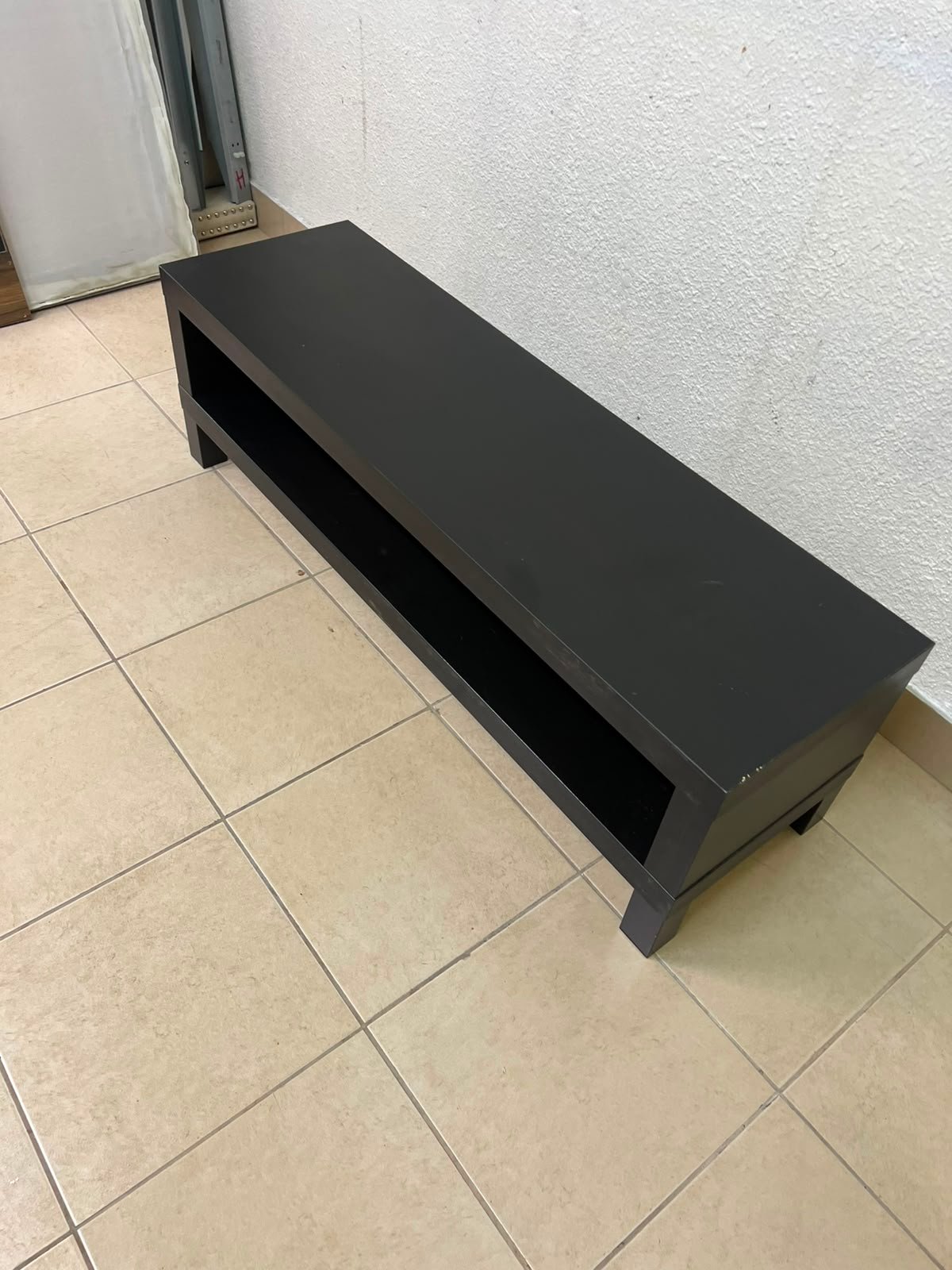 The image shows a TV stand from the IKEA LACK collection in black and brown. - Image 2