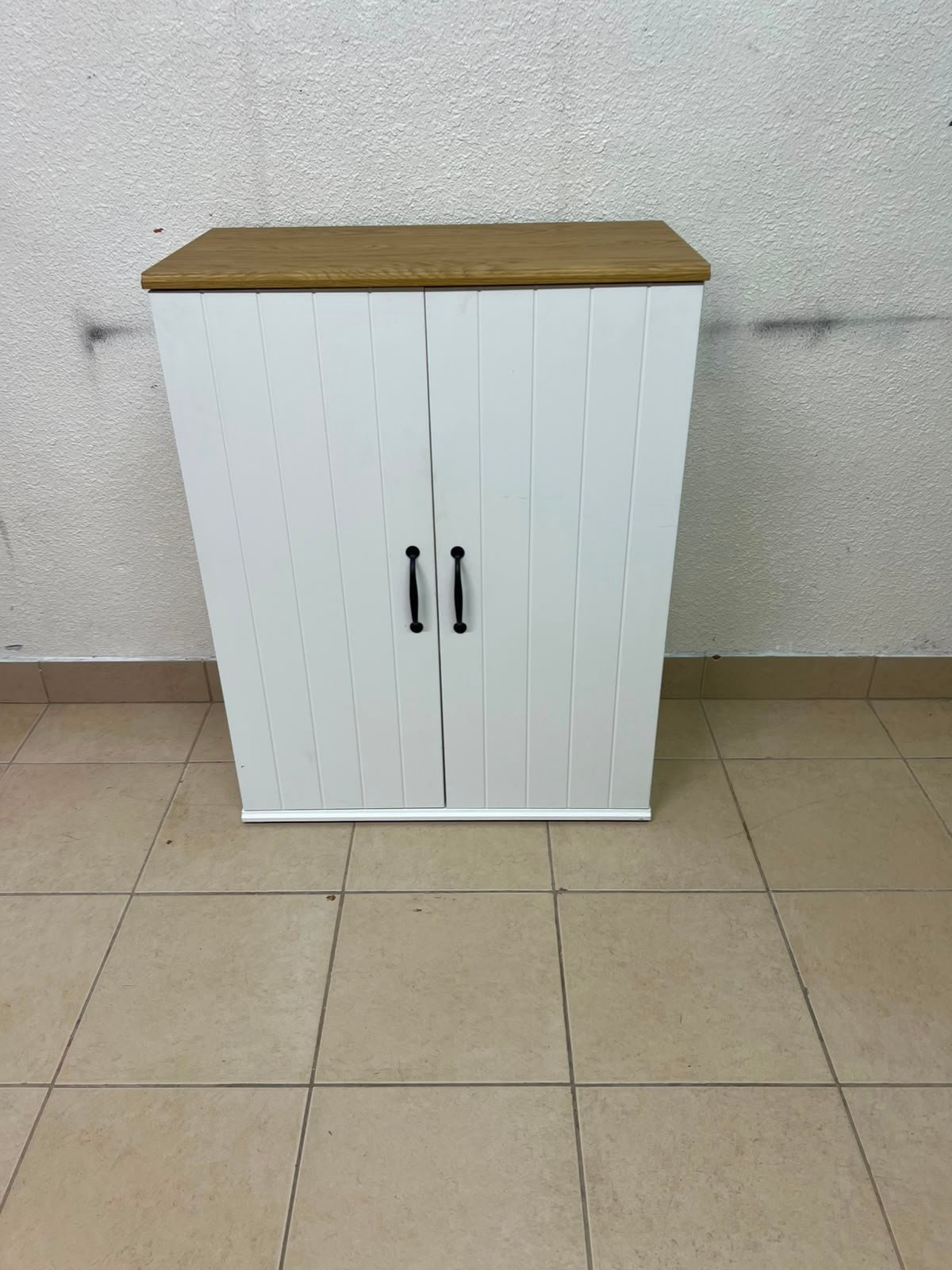 This is the SKRUVBY wardrobe with white doors, measuring 70x90 cm, from IKEA.