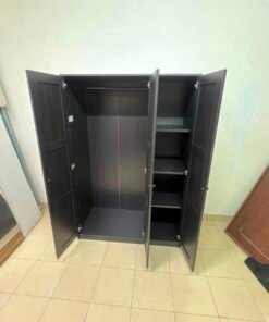 The RAKKESTAD wardrobe from IKEA has three doors and comes in a black-brown color, measuring 117x176 cm. - Image 4