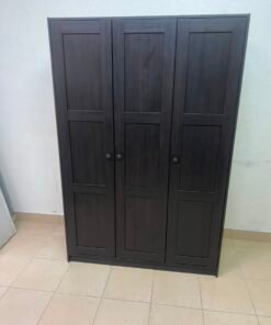 The RAKKESTAD wardrobe from IKEA has three doors and comes in a black-brown color, measuring 117x176 cm. - Image 12