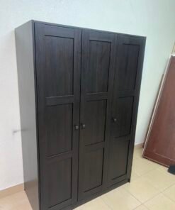 The RAKKESTAD wardrobe from IKEA has three doors and comes in a black-brown color, measuring 117x176 cm.