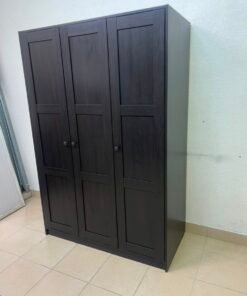 The RAKKESTAD wardrobe from IKEA has three doors and comes in a black-brown color, measuring 117x176 cm. - Image 10