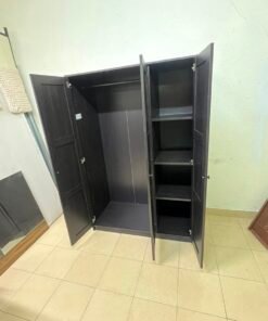The RAKKESTAD wardrobe from IKEA has three doors and comes in a black-brown color, measuring 117x176 cm. - Image 7