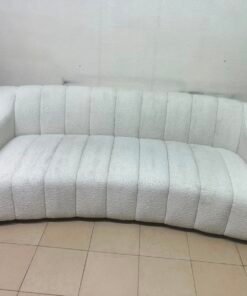 With the cream-colored Eichholtz Kelly Bouclé sofa, which features a distinctive design with signature vertical stitching and soft-touch upholstery. - Image 14
