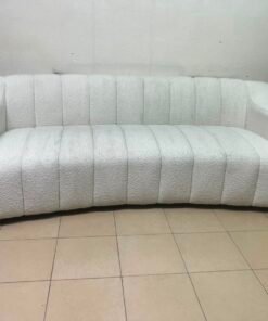 With the cream-colored Eichholtz Kelly Bouclé sofa, which features a distinctive design with signature vertical stitching and soft-touch upholstery. - Image 13