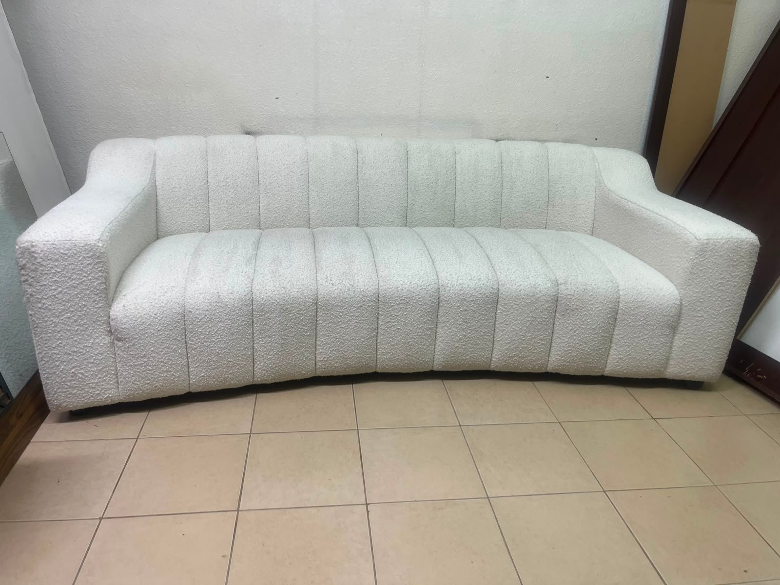 With the cream-colored Eichholtz Kelly Bouclé sofa, which features a distinctive design with signature vertical stitching and soft-touch upholstery. - Image 13