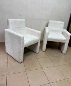 A modern white boucle fabric armchair, featuring an elegant base with flat legs and textured fabric upholstery. - Image 4