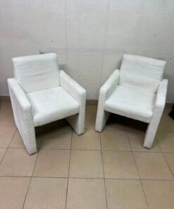 A modern white boucle fabric armchair, featuring an elegant base with flat legs and textured fabric upholstery. - Image 2