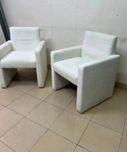 A modern white boucle fabric armchair, featuring an elegant base with flat legs and textured fabric upholstery. - Image 3