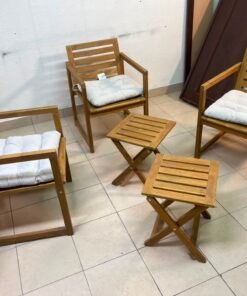 displays the IKEA NÄMMARÖ light brown stained outdoor armchairs and matching folding tables paired with KUDDARNA light gray-beige cushions. - Image 3