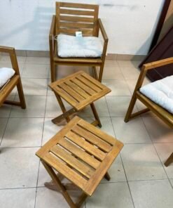 displays the IKEA NÄMMARÖ light brown stained outdoor armchairs and matching folding tables paired with KUDDARNA light gray-beige cushions. - Image 6
