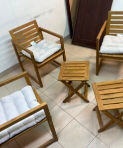 displays the IKEA NÄMMARÖ light brown stained outdoor armchairs and matching folding tables paired with KUDDARNA light gray-beige cushions. - Image 8